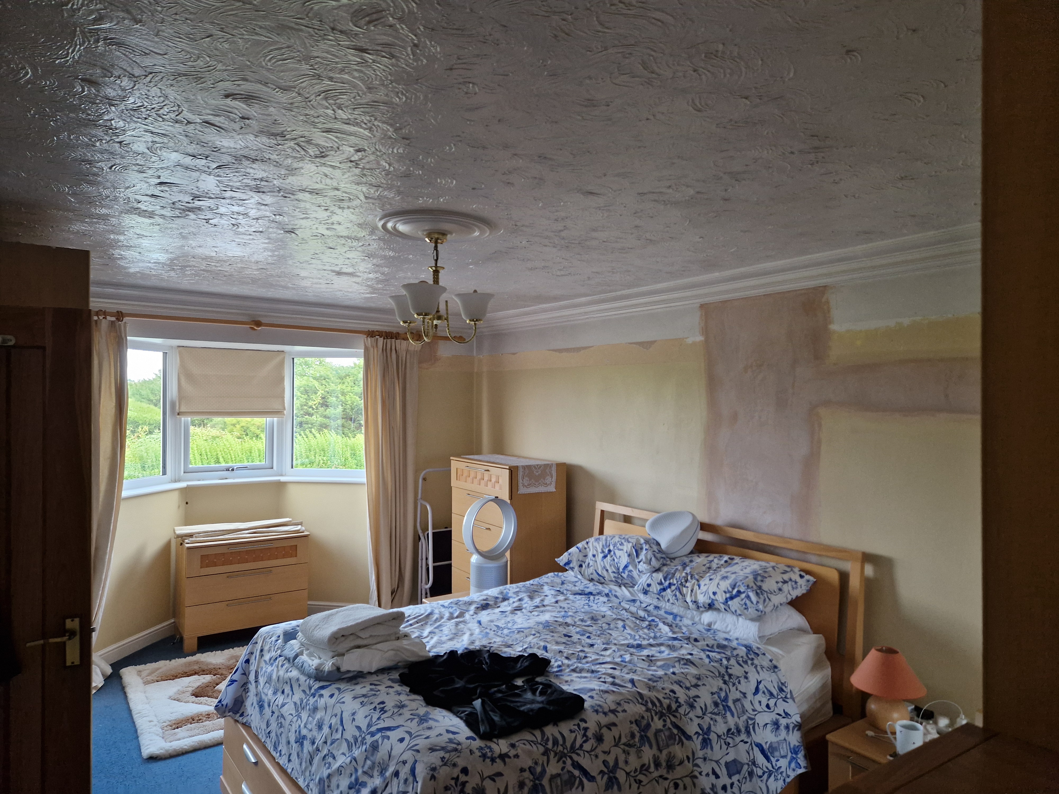 Hallway ceiling repainted to cover old marks